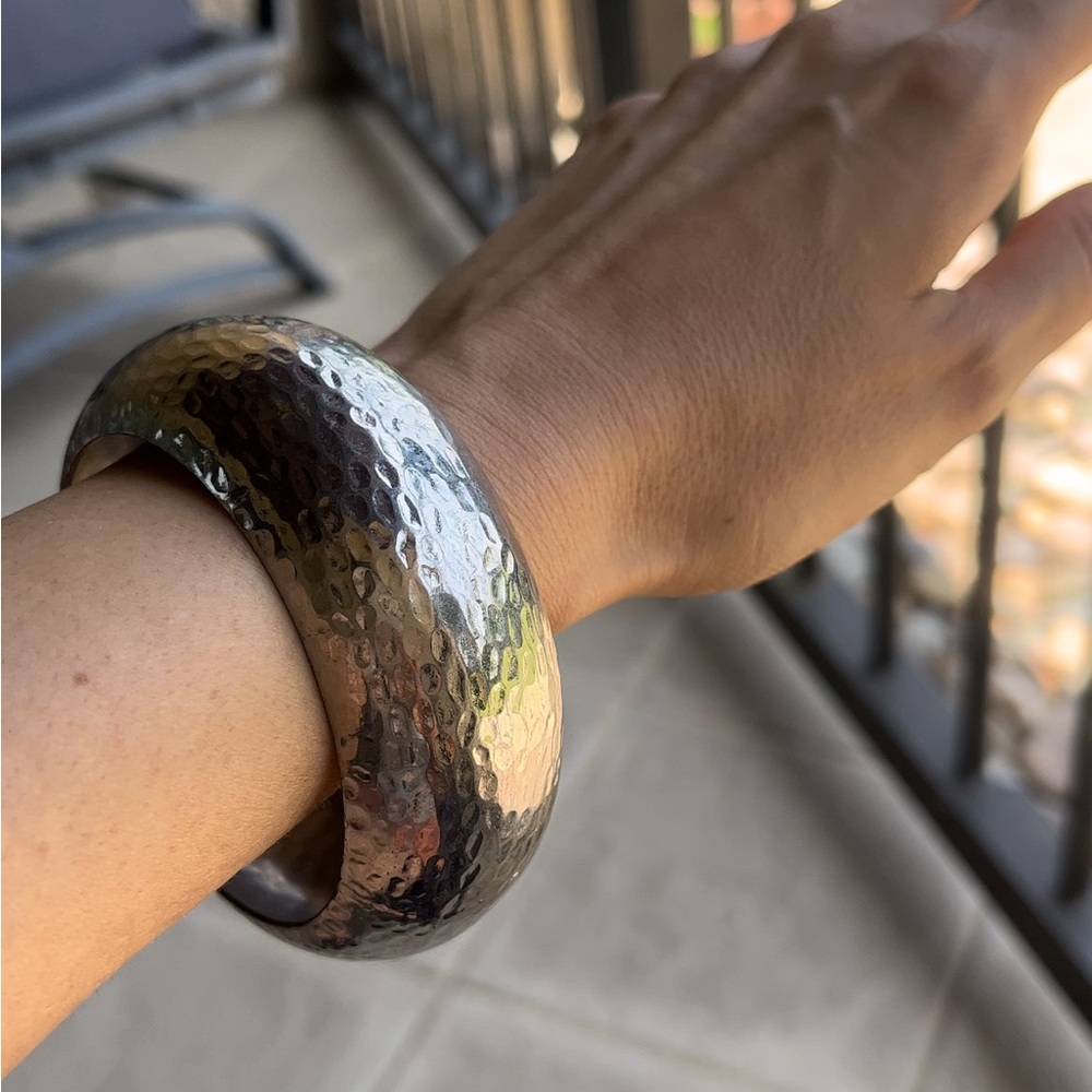 Hammered Metal Silver colored bangle or bracelet.